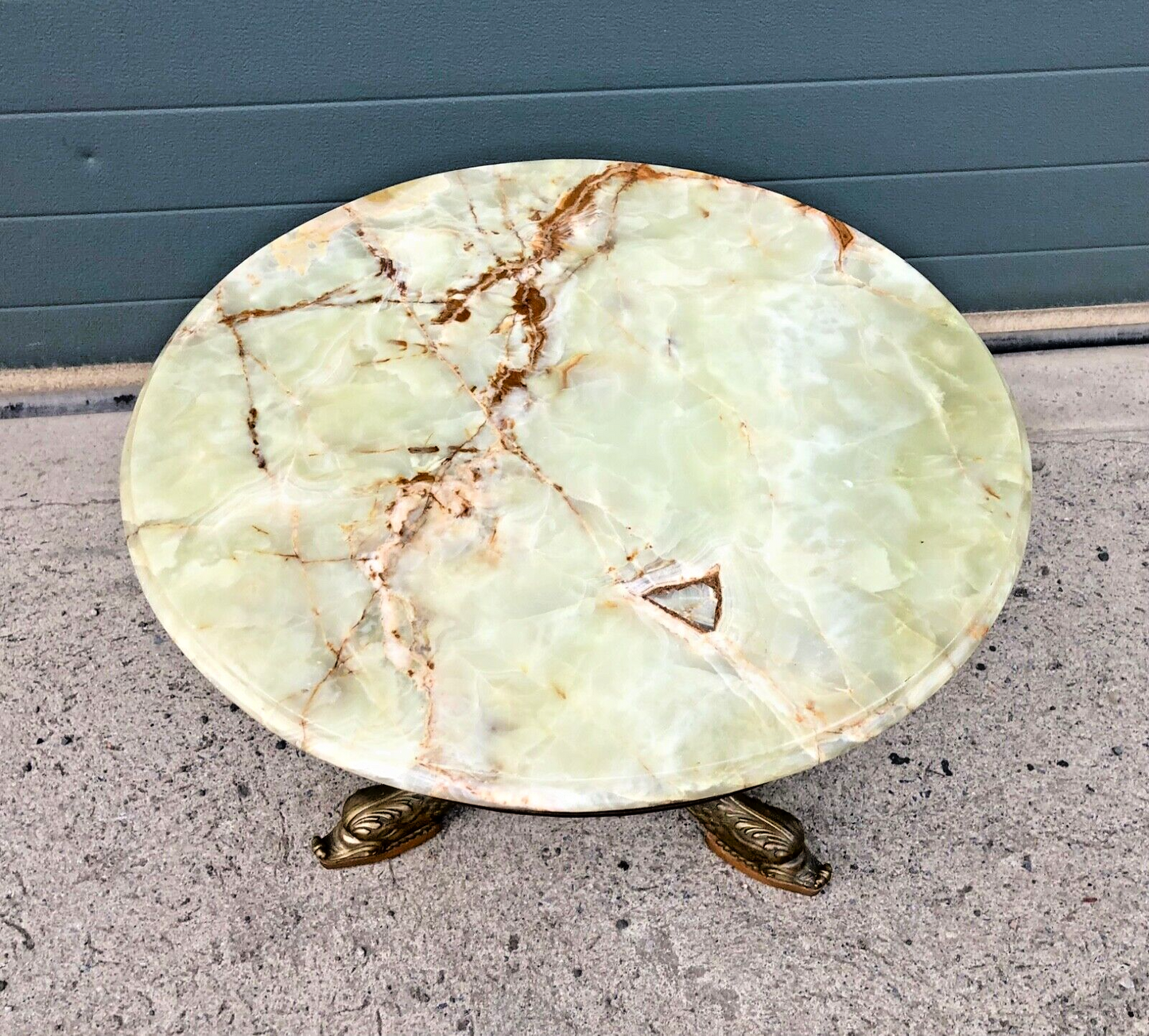 000832....Round Onyx Coffee Table On Decorative Dolphin Brass Base. ( Sold )