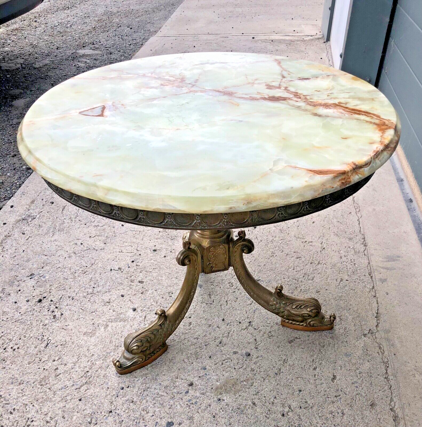 000832....Round Onyx Coffee Table On Decorative Dolphin Brass Base. ( Sold )
