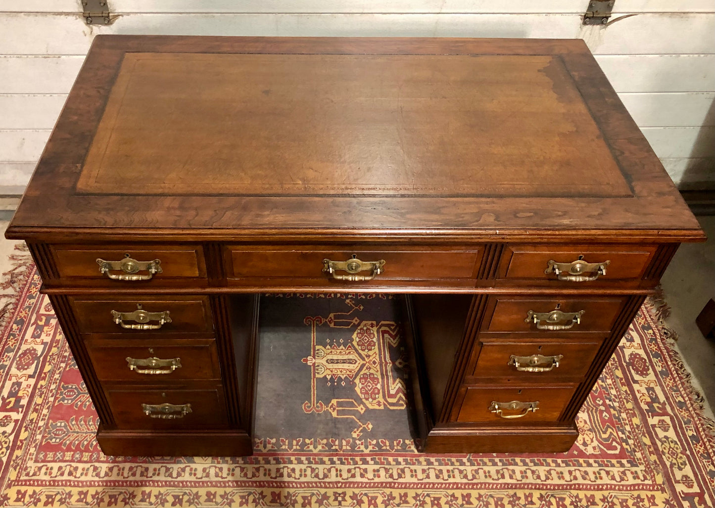 000639....Handsome Antique Walnut Pedestal Desk With Nine Drawers