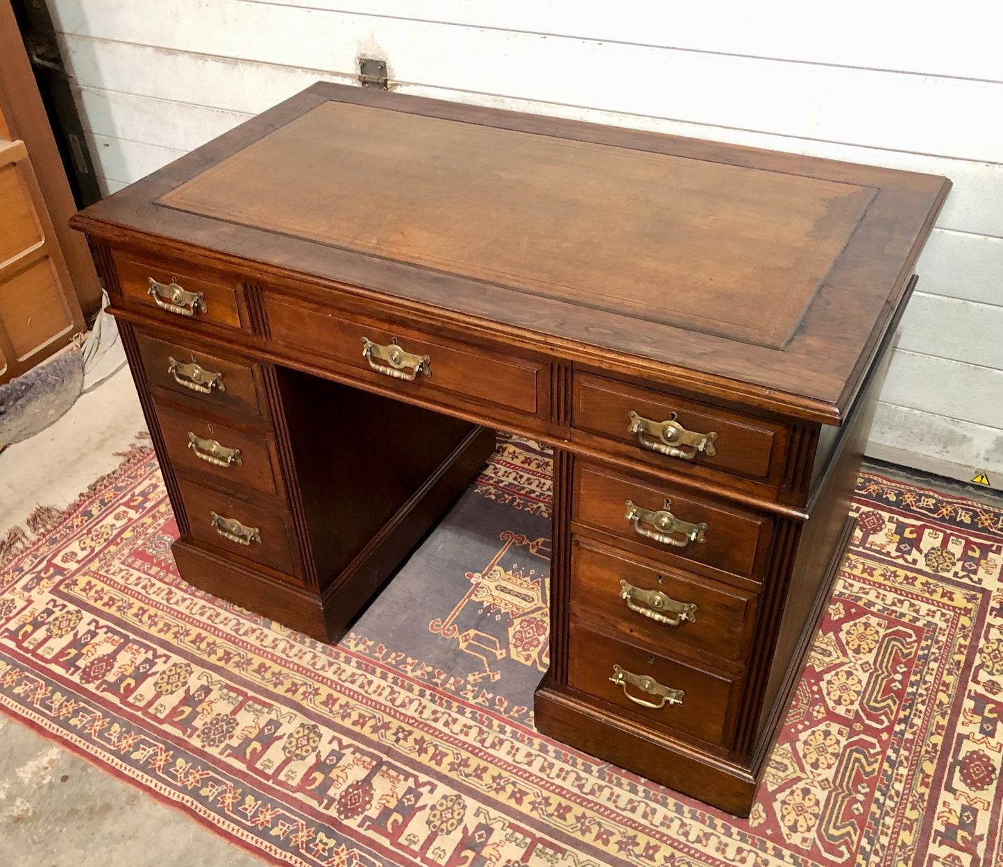 000639....Handsome Antique Walnut Pedestal Desk With Nine Drawers