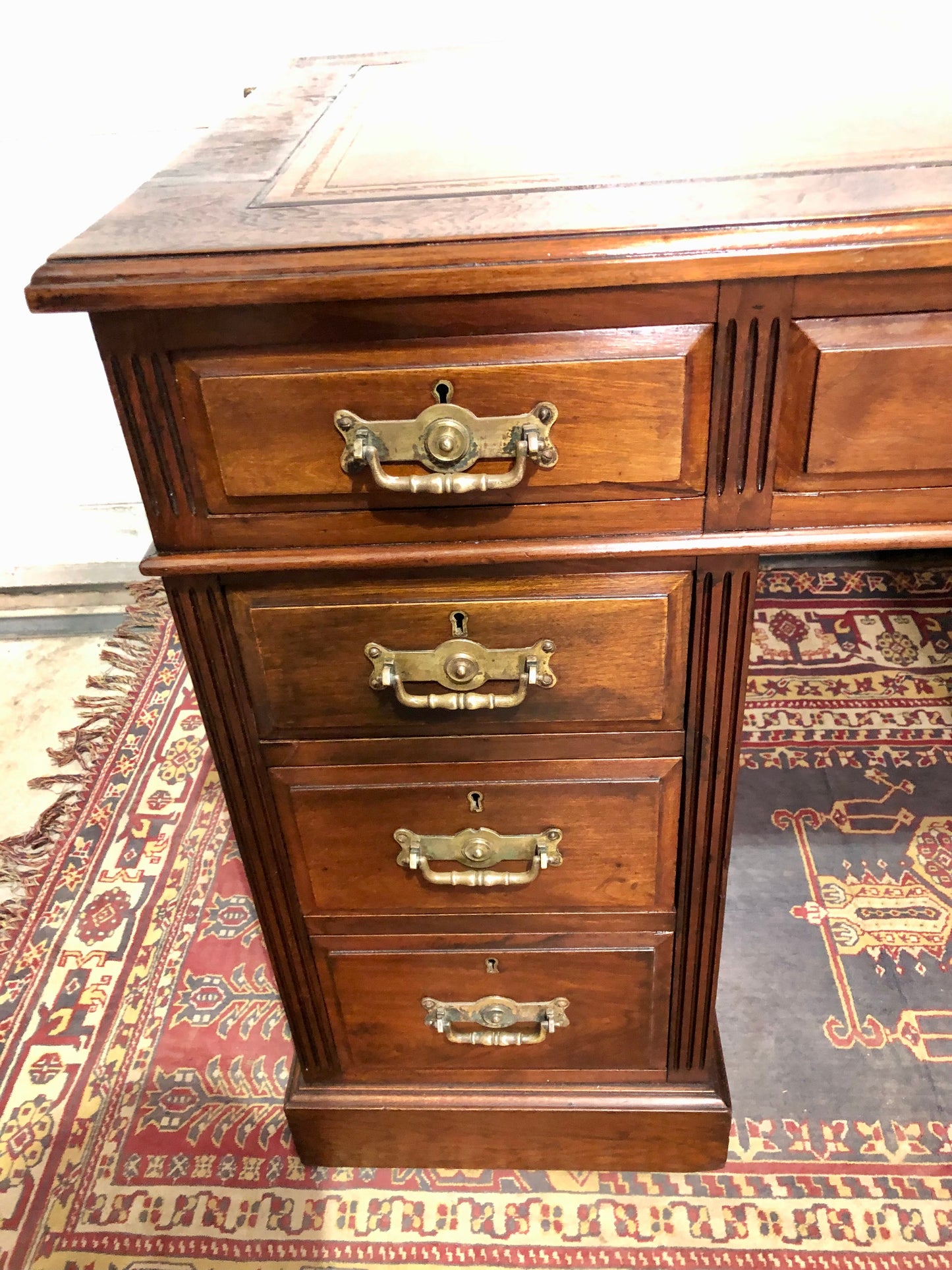 000639....Handsome Antique Walnut Pedestal Desk With Nine Drawers