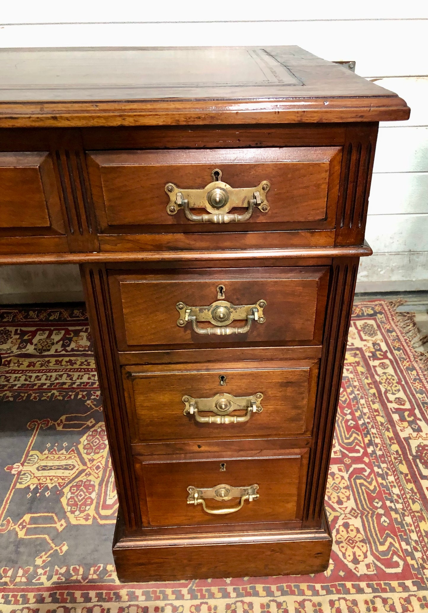000639....Handsome Antique Walnut Pedestal Desk With Nine Drawers