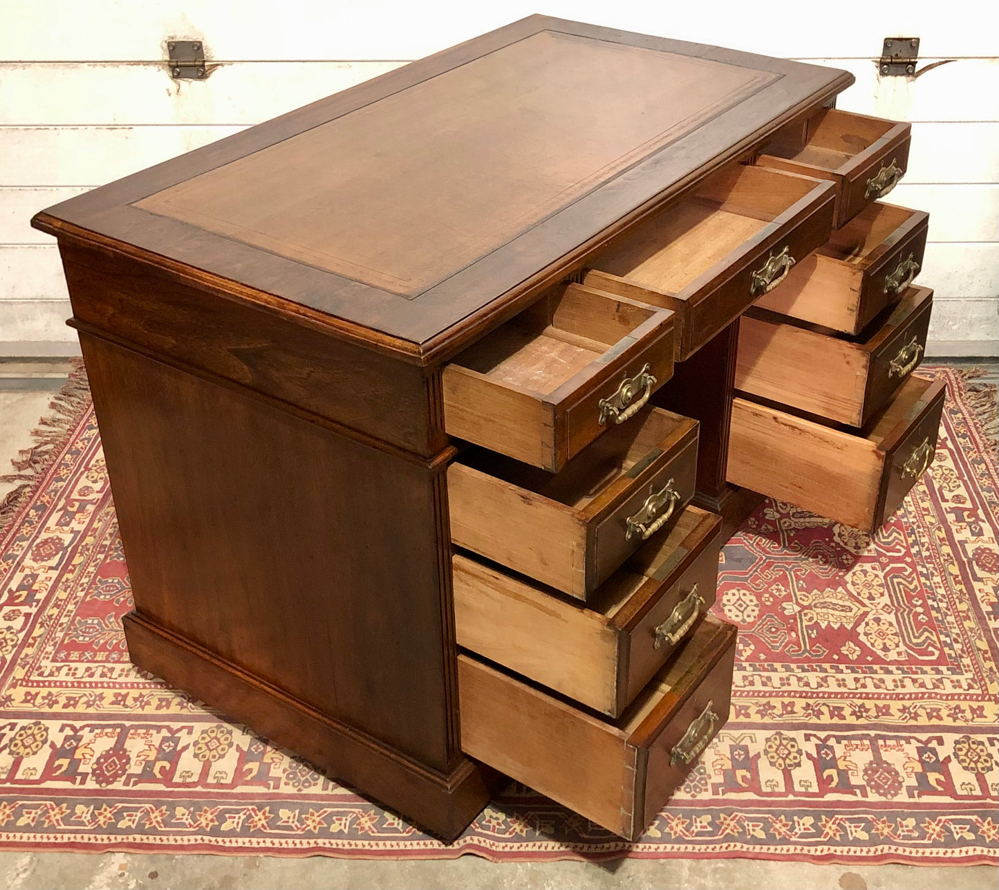 000639....Handsome Antique Walnut Pedestal Desk With Nine Drawers