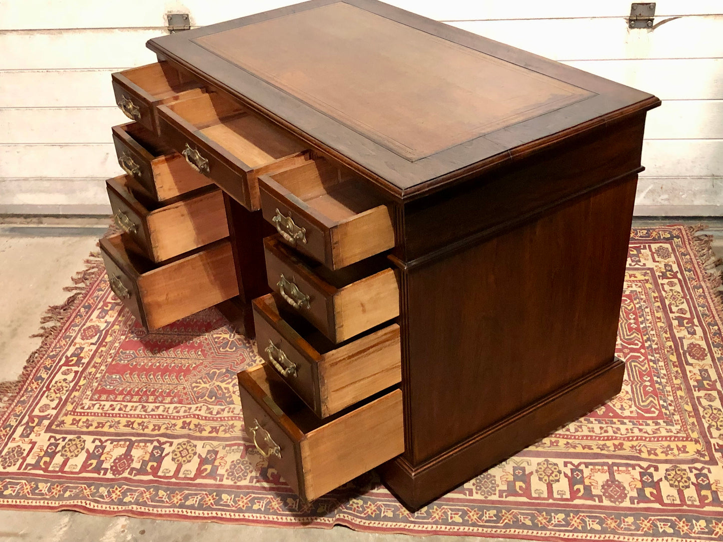000639....Handsome Antique Walnut Pedestal Desk With Nine Drawers
