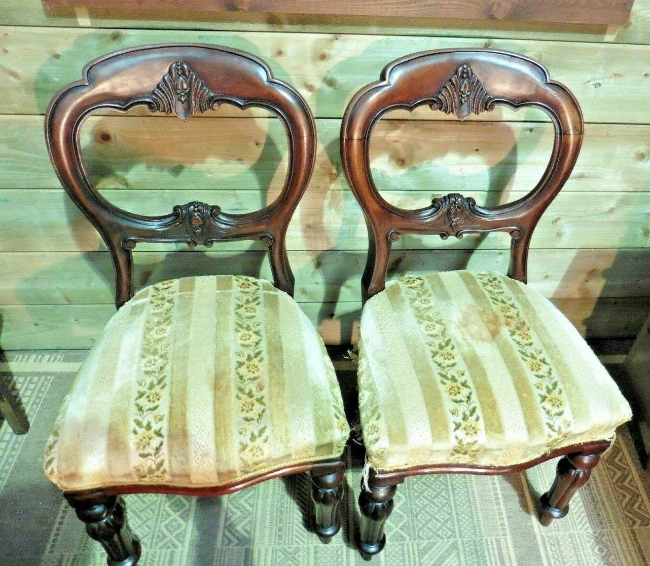A Set Of Four Antique Carved Mahogany Balloon Back Dining Chairs