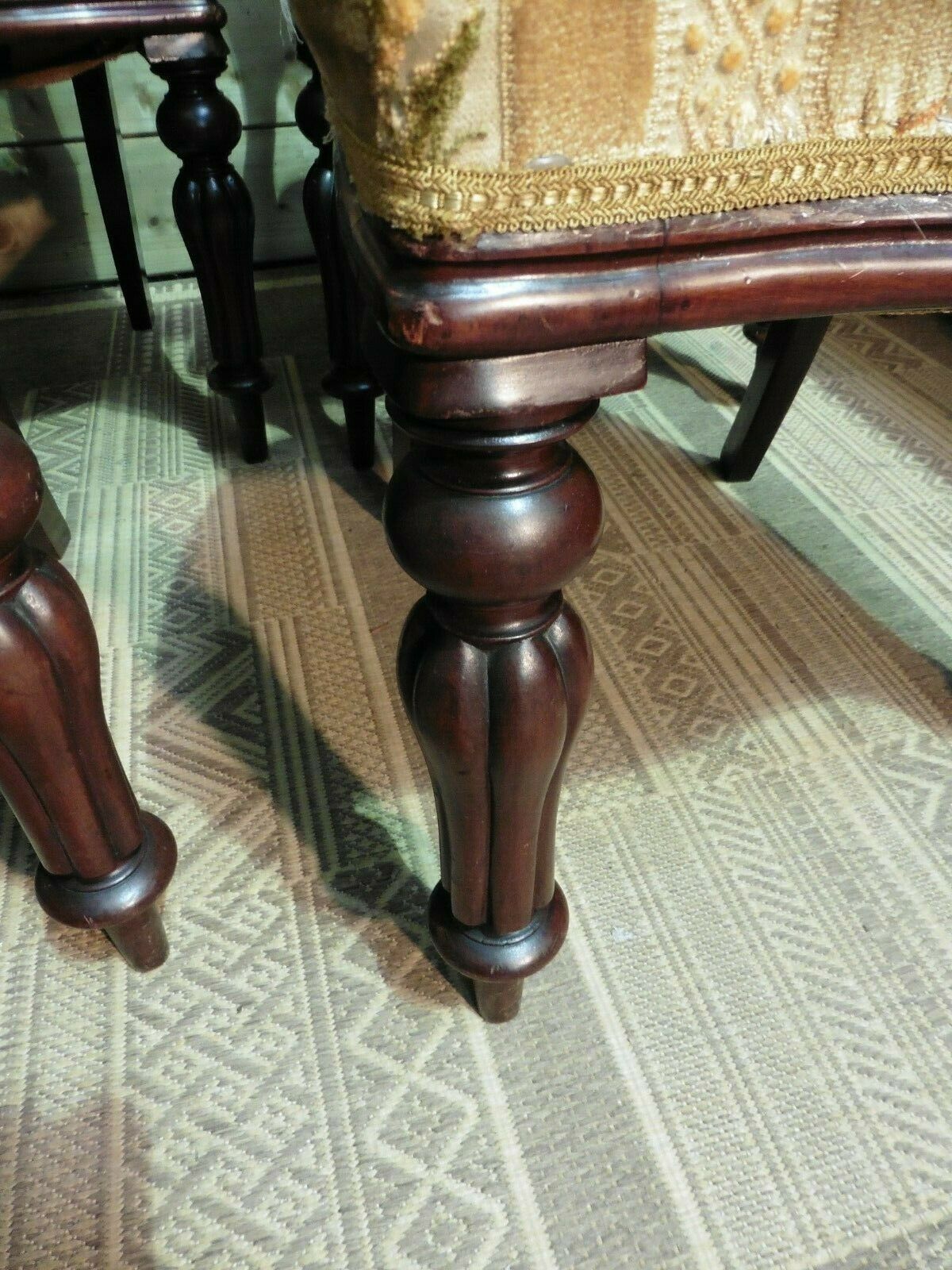 A Set Of Four Antique Carved Mahogany Balloon Back Dining Chairs