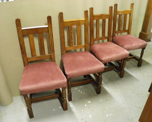 A Set Of Four Arts And Crafts Oak Dining Chairs